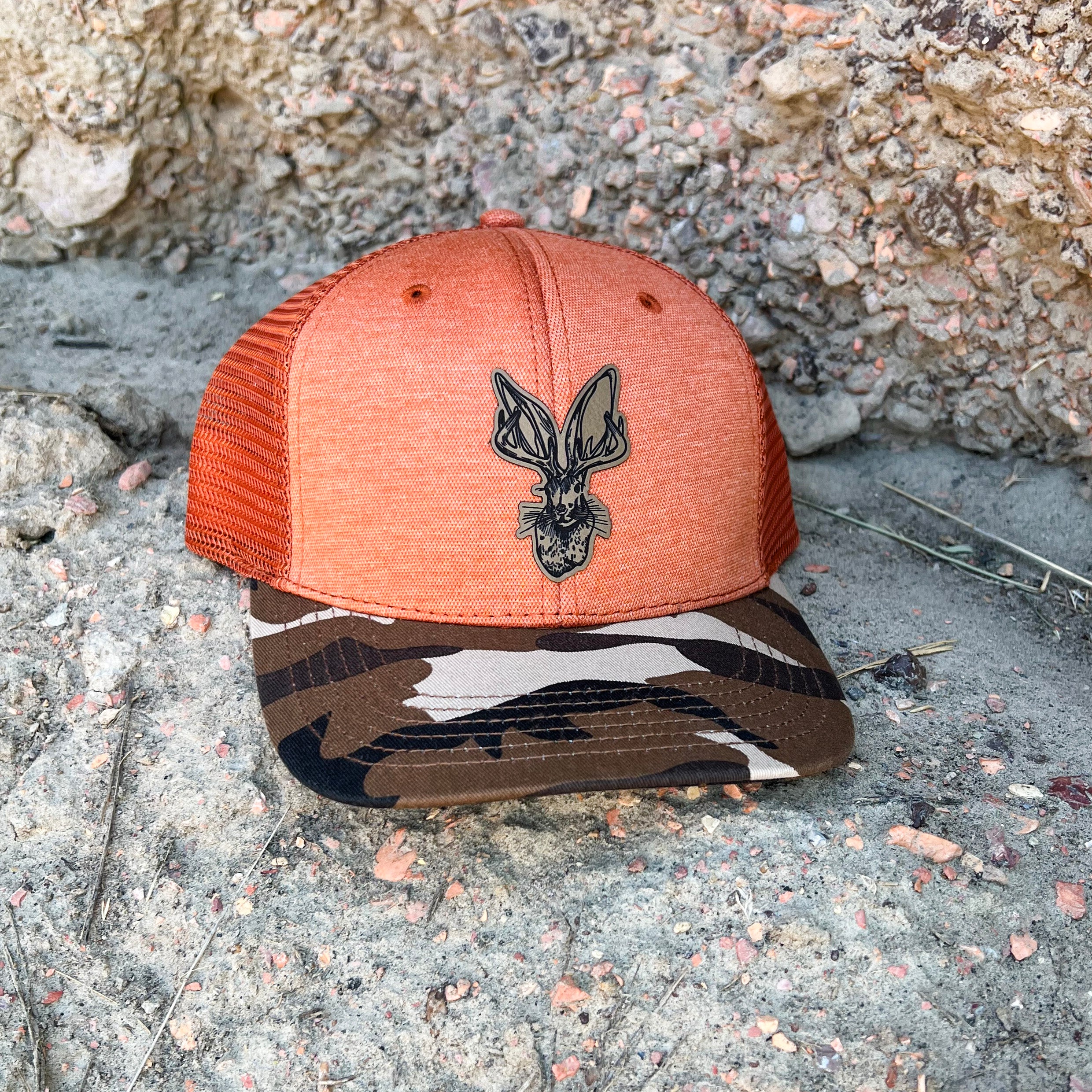 Jackalope mesh trucker cap with camo bill. Wyoming artisan designed. Printed in Wright, WY. Roam Around Wear is a Wyoming t-shirt company based out of Gillette, WY